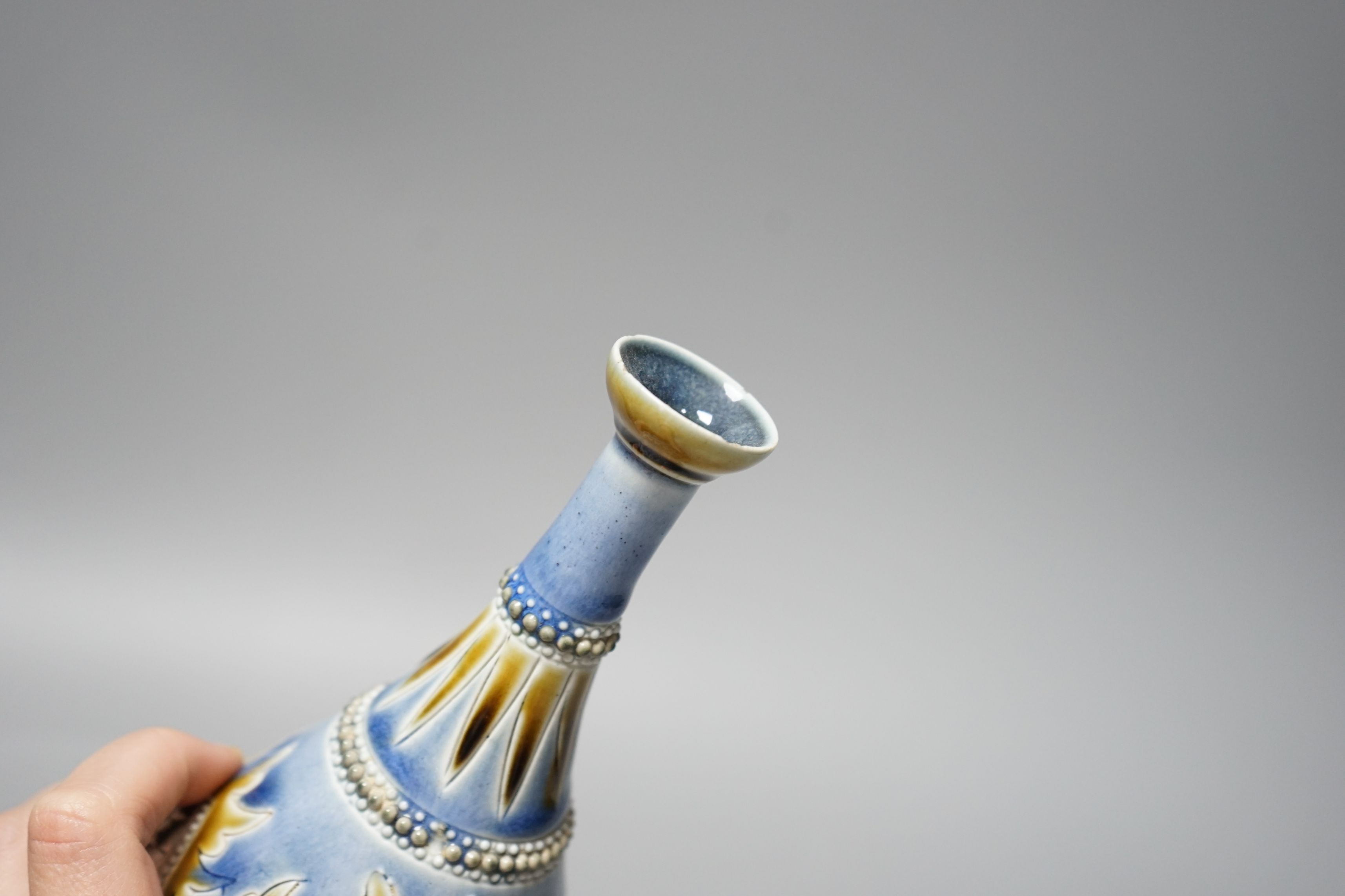George Tinworth, a pair of Doulton Lambeth vases, stamped 1876, 20cm high